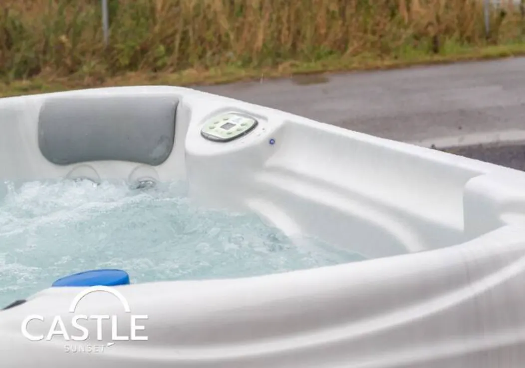 The private hot tub in the enclosed garden at Castle Sunset on the Beach